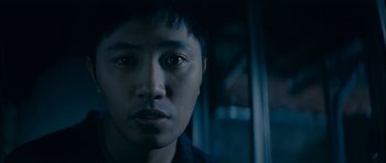 Movie still from “Mother” (2009), directed by Bong Joon Ho – A man's face in the dark; Close Up shot, Low angle