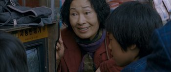 Movie still from “Mother” (2009), directed by Bong Joon Ho – An older woman and a young girl looking at each other; Close Up shot, Over the shoulder angle