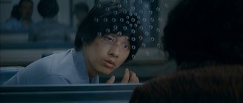 Movie still from “Mother” (2009), directed by Bong Joon Ho – A young man looking out of a window; Close Up shot, Over the shoulder angle