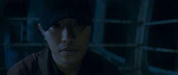 Movie still from “Mother” (2009), directed by Bong Joon Ho – A person wearing a hat; Close Up shot, Low angle