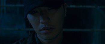 Movie still from “Mother” (2009), directed by Bong Joon Ho – A person wearing a hat; Extreme Close Up shot, High angle