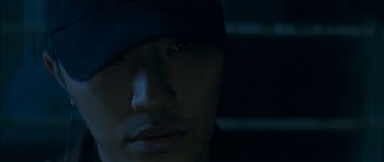 Movie still from “Mother” (2009), directed by Bong Joon Ho – A man's face in the dark; Extreme Close Up shot, Low angle