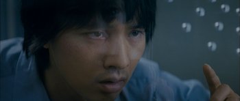 Movie still from “Mother” (2009), directed by Bong Joon Ho – A person looking at the camera; Extreme Close Up shot, High angle