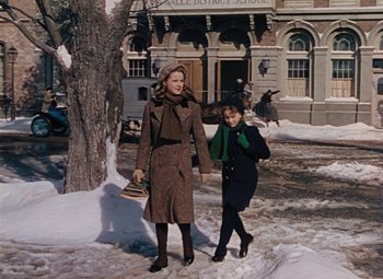 Movie still from “Mother Wore Tights” (1947), directed by Walter Lang – A woman and a child are walking in the snow; Wide shot, Low angle