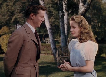 Movie still from “Mother Wore Tights” (1947), directed by Walter Lang – A man and a woman talking to each other outside; Medium shot, Low angle