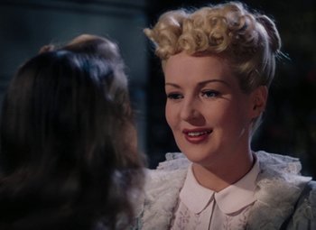 Movie still from “Mother Wore Tights” (1947), directed by Walter Lang – A person wearing a dress; Close Up shot, Over the shoulder angle