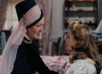 Movie still from “Mother Wore Tights” (1947), directed by Walter Lang – A woman and a young girl are talking to each other; Close Up shot, Over the shoulder angle