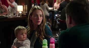 Movie still from “Mother's Day” (2016), directed by Garry Marshall – A woman sitting at a table with a baby; Close Up shot, Over the shoulder angle