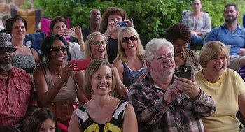 Movie still from “Mother's Day” (2016), directed by Garry Marshall – A group of people standing in front of each other; Medium shot, Over the shoulder angle