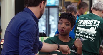 Movie still from “Mother's Day” (2016), directed by Garry Marshall – A man and a woman shaking hands at a table; Medium shot, Over the shoulder angle