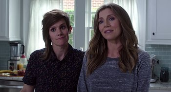 Movie still from “Mother's Day” (2016), directed by Garry Marshall – Two women standing next to each other in front of a window; Close Up shot, Over the shoulder angle