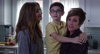 Movie still from “Mother's Day” (2016), directed by Garry Marshall – Two women and a young boy standing next to each other; Medium shot, Over the shoulder angle
