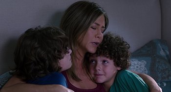 Movie still from “Mother's Day” (2016), directed by Garry Marshall – A woman and two boys are hugging each other; Close Up shot, Overhead angle