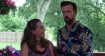 Movie still from “Mother's Day” (2016), directed by Garry Marshall – A man and a woman standing next to each other in front of a tree; Medium shot, Over the shoulder angle