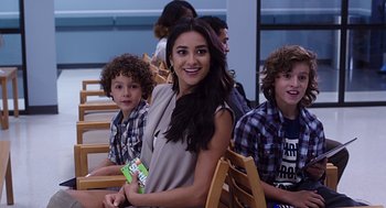 Movie still from “Mother's Day” (2016), directed by Garry Marshall – A group of young people sitting next to each other; Medium shot, Over the shoulder angle