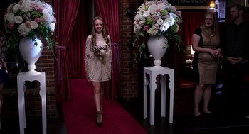 Movie still from “Mother's Day” (2016), directed by Garry Marshall – A young girl walking down the aisle of a wedding ceremony; Wide shot, Over the shoulder angle