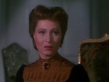 Movie still from “Moulin Rouge” (1952), directed by John Huston – A person wearing a dress; Close Up shot, Over the shoulder angle