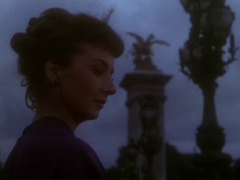 Movie still from “Moulin Rouge” (1952), directed by John Huston – A woman standing in front of a statue in the dark; Close Up shot, Low angle