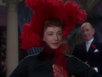 Movie still from “Moulin Rouge” (1952), directed by John Huston – A person wearing a hat; Close Up shot, Low angle
