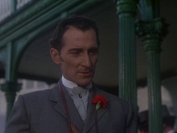 Movie still from “Moulin Rouge” (1952), directed by John Huston – A person wearing a suit and tie; Close Up shot, Low angle