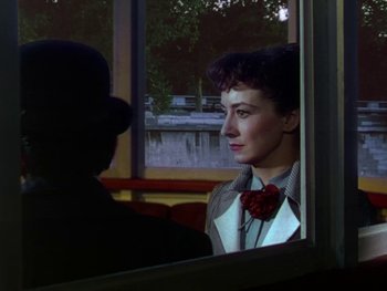 Movie still from “Moulin Rouge” (1952), directed by John Huston – A man and a woman looking out of a window; Close Up shot, Over the shoulder angle