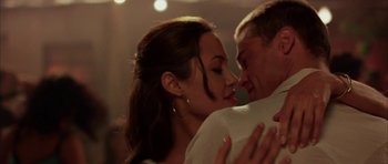 Movie still from “Mr. & Mrs. Smith” (2005), directed by Doug Liman – A man and a woman embracing each other in a room; Close Up shot, Low angle