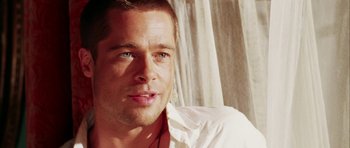 Movie still from “Mr. & Mrs. Smith” (2005), directed by Doug Liman – A man in a white shirt is looking at the camera; Close Up shot, Over the shoulder angle