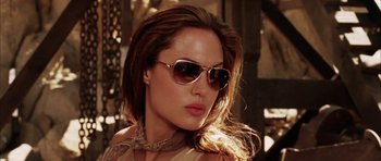 Movie still from “Mr. & Mrs. Smith” (2005), directed by Doug Liman – A person wearing sunglasses; Close Up shot, Low angle