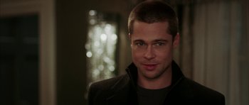 Movie still from “Mr. & Mrs. Smith” (2005), directed by Doug Liman – A person wearing a jacket; Close Up shot, Over the shoulder angle