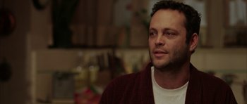 Movie still from “Mr. & Mrs. Smith” (2005), directed by Doug Liman – A person wearing a sweater; Close Up shot, Over the shoulder angle