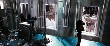 Movie still from “Mr. & Mrs. Smith” (2005), directed by Doug Liman – A room filled with furniture and a large window; Wide shot, High angle