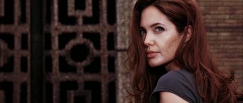 Movie still from “Mr. & Mrs. Smith” (2005), directed by Doug Liman – A person with long brown hair; Close Up shot, Low angle