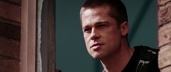 Movie still from “Mr. & Mrs. Smith” (2005), directed by Doug Liman – A person wearing a shirt; Close Up shot, Over the shoulder angle