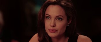 Movie still from “Mr. & Mrs. Smith” (2005), directed by Doug Liman – A woman with brown hair and green eyes; Close Up shot, Over the shoulder angle