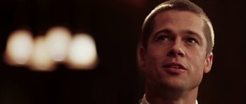 Movie still from “Mr. & Mrs. Smith” (2005), directed by Doug Liman – A person looking up at the sky; Close Up shot, Low angle