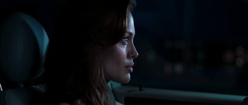 Movie still from “Mr. & Mrs. Smith” (2005), directed by Doug Liman – A person in a car at night; Close Up shot, Over the shoulder angle