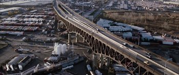 Movie still from “Mr. & Mrs. Smith” (2005), directed by Doug Liman – An aerial view of a bridge over a river; Extreme Wide shot, High angle