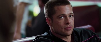 Movie still from “Mr. & Mrs. Smith” (2005), directed by Doug Liman – A person wearing a black shirt; Close Up shot, Over the shoulder angle