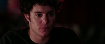 Movie still from “Mr. & Mrs. Smith” (2005), directed by Doug Liman – A man's face in the dark; Close Up shot, Over the shoulder angle