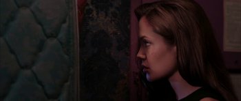 Movie still from “Mr. & Mrs. Smith” (2005), directed by Doug Liman – A person looking at a wall; Close Up shot, Over the shoulder angle