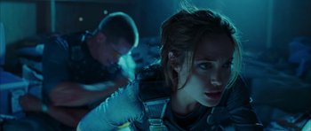 Movie still from “Mr. & Mrs. Smith” (2005), directed by Doug Liman – A person in a space suit; Medium shot, Over the shoulder angle