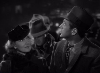 A black and white photo of a man and a woman