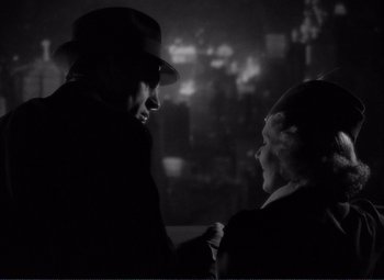 Movie still from “Mr. Deeds Goes to Town” (1936), directed by Frank Capra – A man and a woman are talking to each other; Close Up shot, Low angle