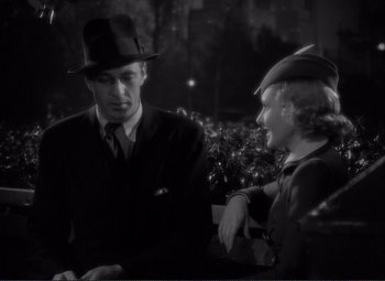 Movie still from “Mr. Deeds Goes to Town” (1936), directed by Frank Capra – A man and a woman talking to each other; Medium shot, High angle