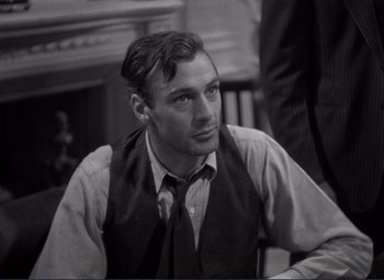 Movie still from “Mr. Deeds Goes to Town” (1936), directed by Frank Capra – Black and white photograph of a man wearing a tie; Close Up shot, Over the shoulder angle