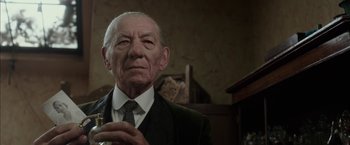 Movie still from “Mr. Holmes” (2015), directed by Bill Condon – An older man in a suit and tie; Close Up shot, Low angle