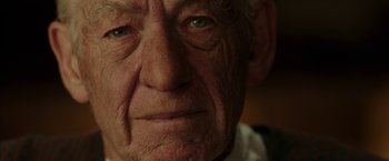 Movie still from “Mr. Holmes” (2015), directed by Bill Condon – An old man with wrinkled skin and blue eyes; Extreme Close Up shot, Low angle