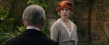 Movie still from “Mr. Holmes” (2015), directed by Bill Condon – An older man and a young woman wearing a hat; Medium shot, Over the shoulder angle