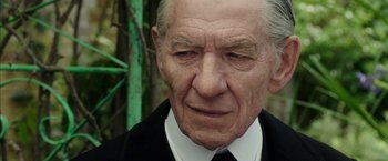 Movie still from “Mr. Holmes” (2015), directed by Bill Condon – An older man in a suit and tie; Close Up shot, Low angle