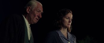 Movie still from “Mr. Holmes” (2015), directed by Bill Condon – An older man and a younger woman standing next to each other; Medium shot, Low angle